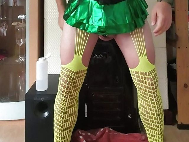 Crossdresser slut in yellow fishnet green miniskirt and black corsage opens his hole with big toys nipple pumps, chastity (One2chris Gaystuff)